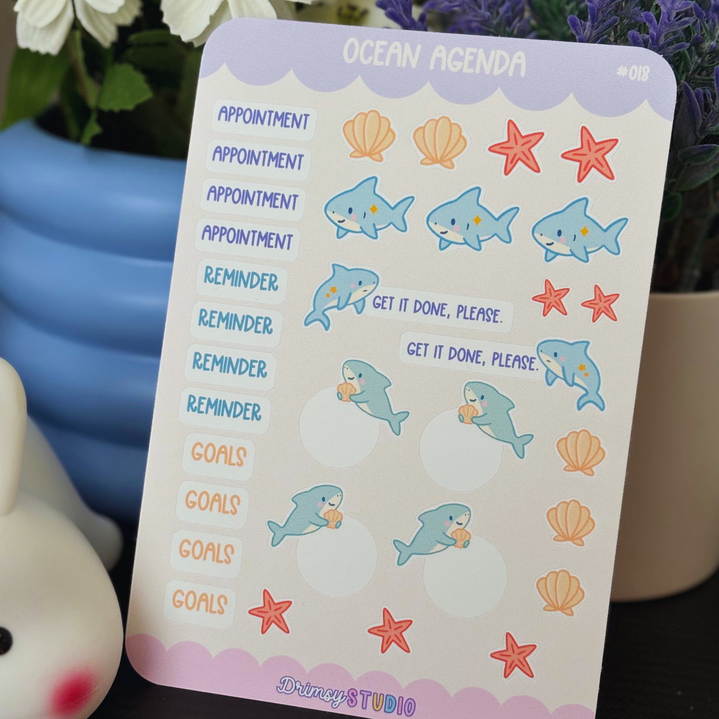 Ocean Agenda planner sticker sheet with sharks, shells, starfish, and text labels.