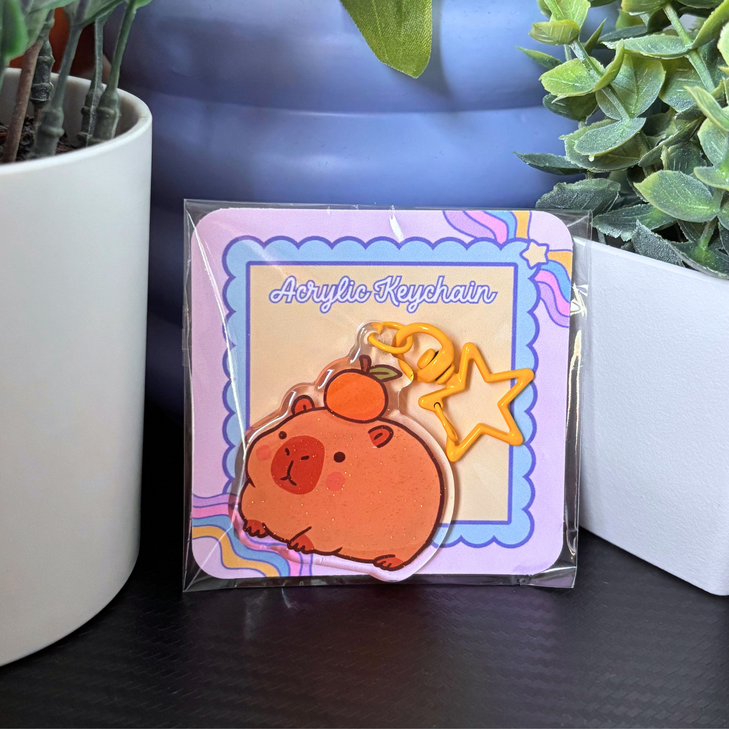 Capybara With Orange Epoxy Acrylic Keychain | Glittery Accessory with Star Key Ring