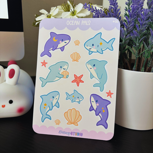 Ocean Pals sticker sheet with cute sharks, shells, and starfish.