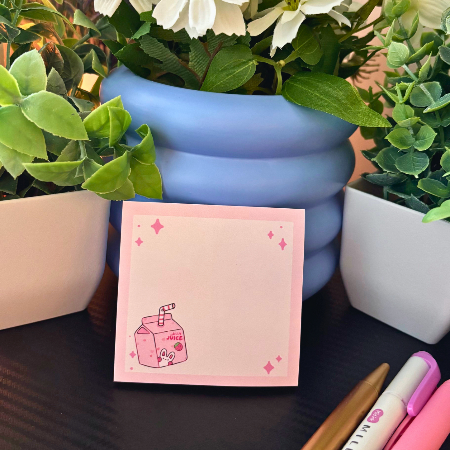 Pink sticky notes pad with a kawaii juice box design and sparkly accents.